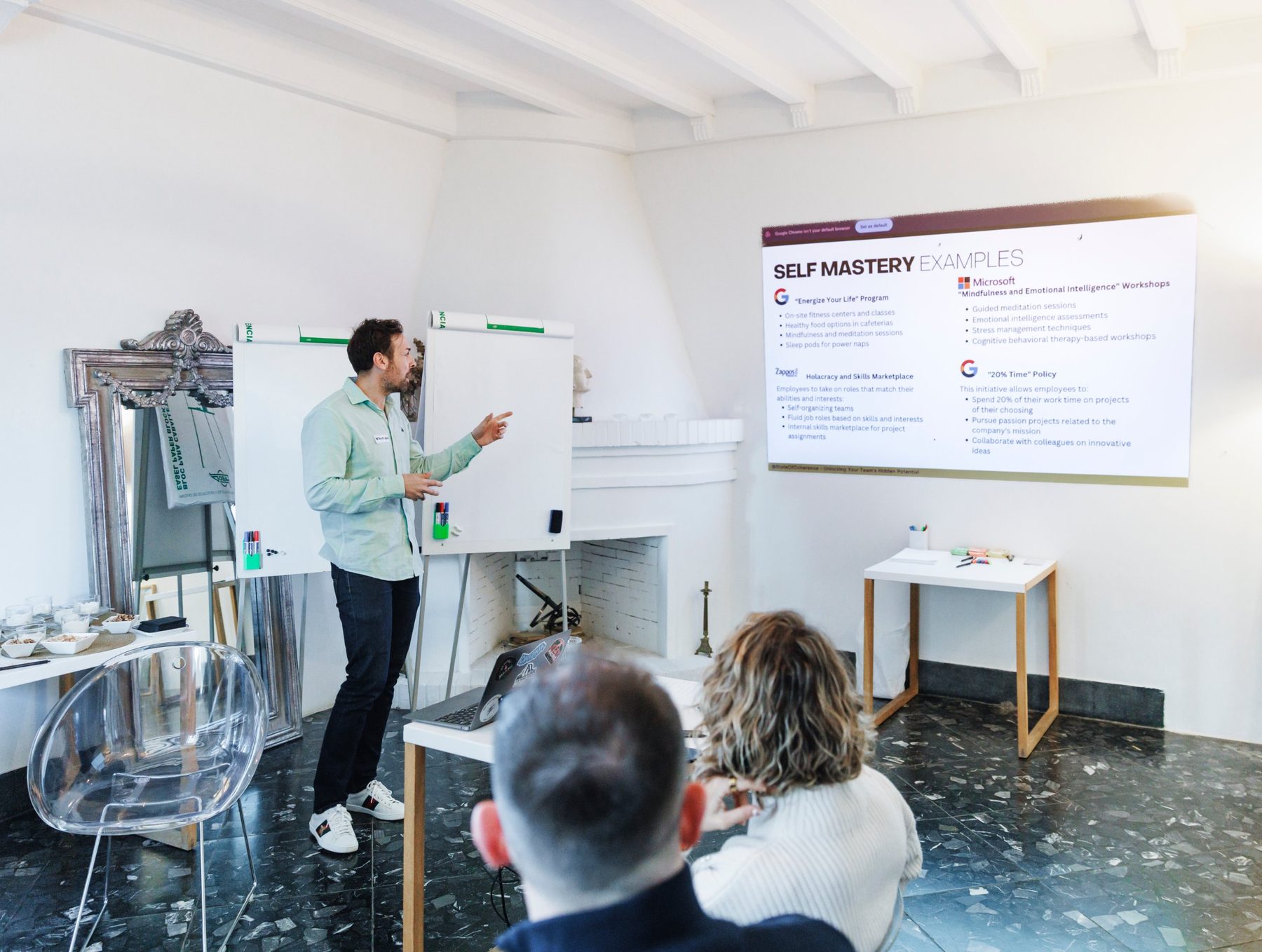 Jose M Bermejo presents a slide titled Self mastery examples to a small group in a white workshop room.